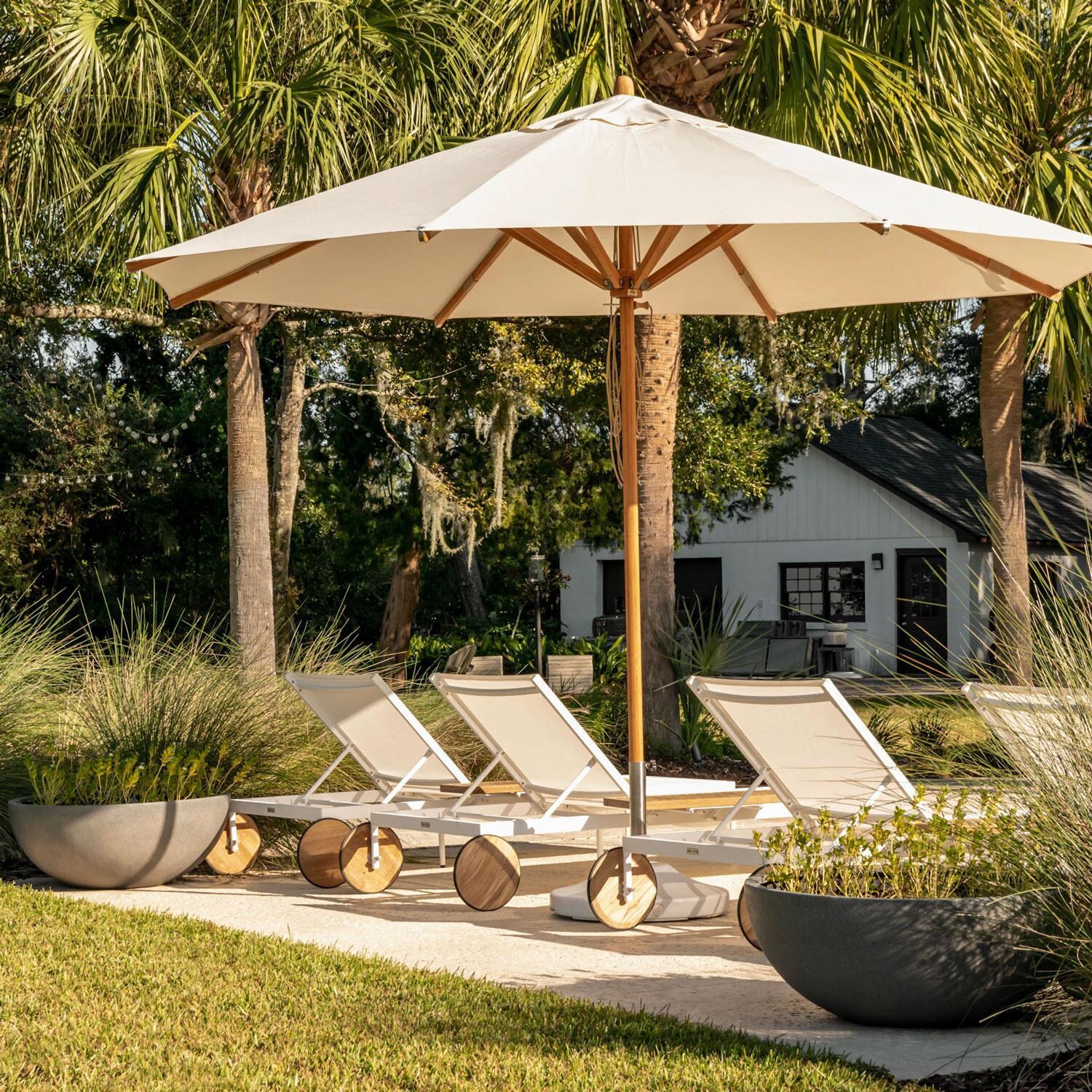 Teak + Table St Barts Aluminum Chaise Lounge in White - Under the Umbrella - Lifestyle thumbnail