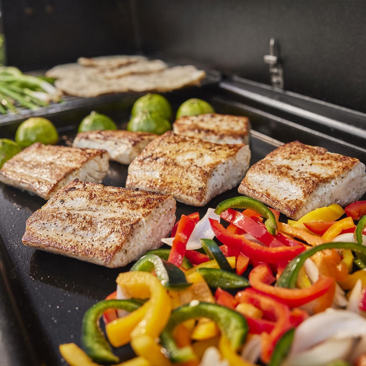 Weber 1500120 Searwood 600 Porcelain Coated Steel Pellet Grill - Fish Tacos on Grill - Lifestyle thumbnail