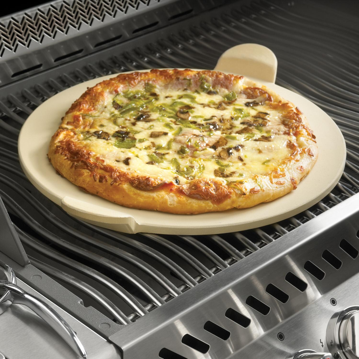 Napoleon PRO 2-Piece Pizza Stone With Pizza Cutter - In Use thumbnail