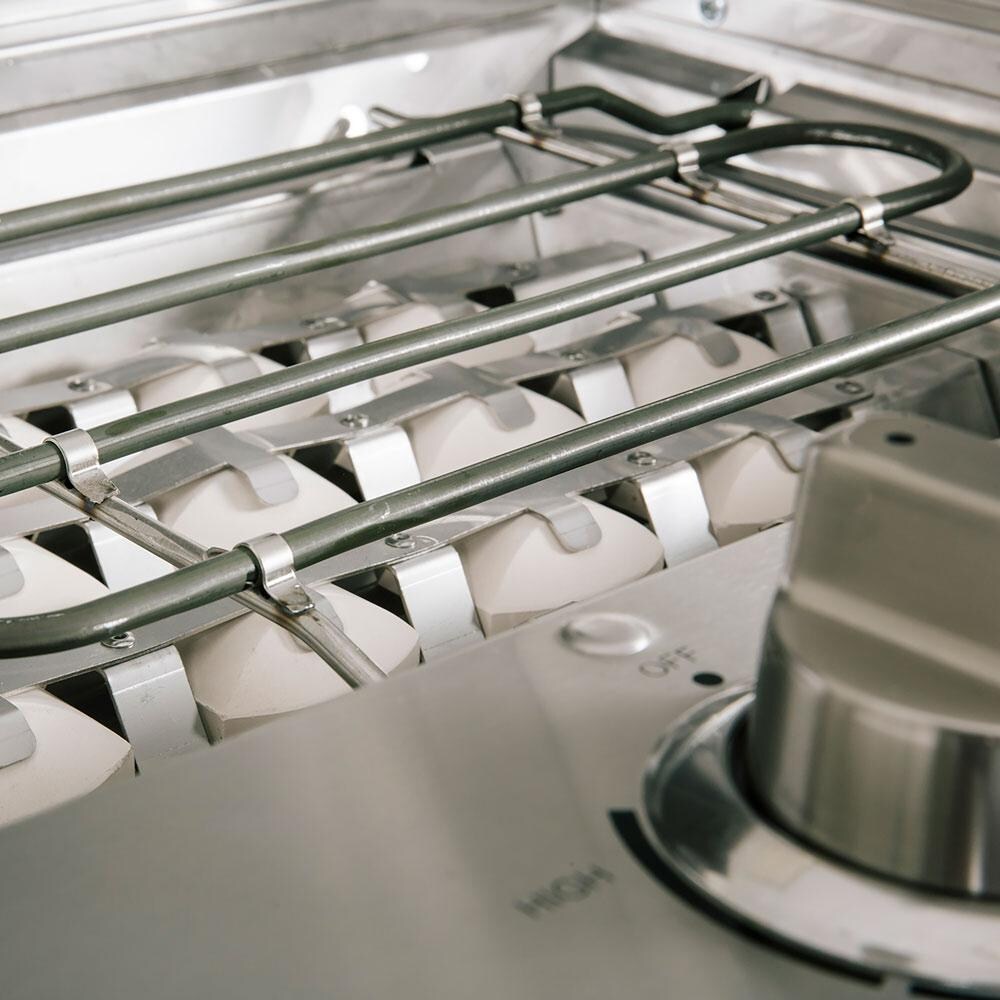 Coyote Portable Electric Grill On Patio Post - Closeup Showing Heating Element And Ceramic Briquettes thumbnail