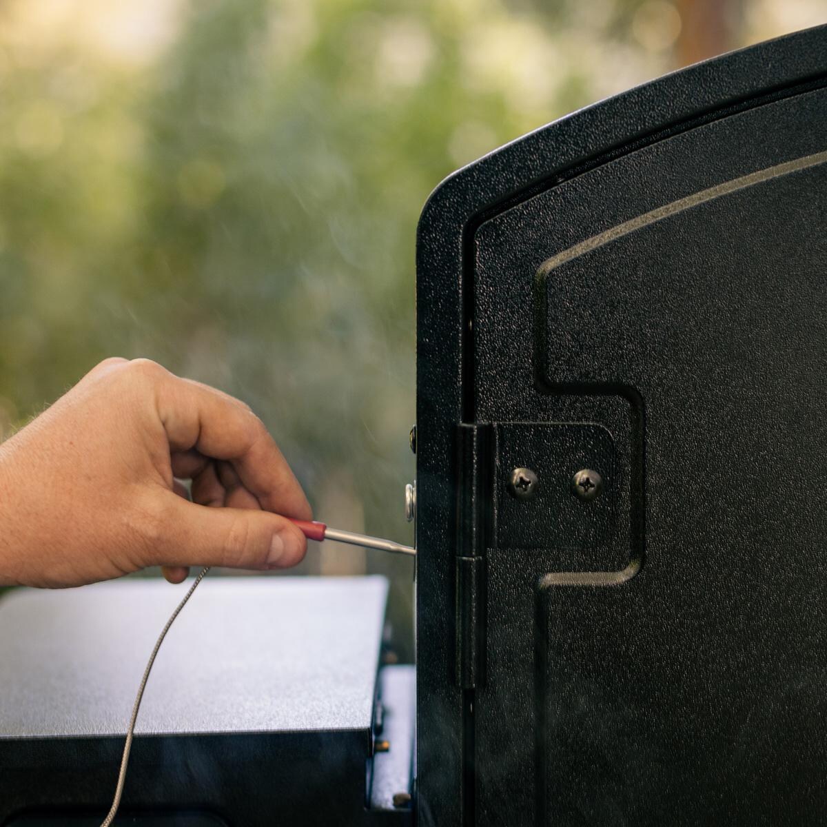 Camp Chef PGSBXXL XXL Pro WIFI Vertical Smoker - Attaching Meat Probe - Lifestyle thumbnail