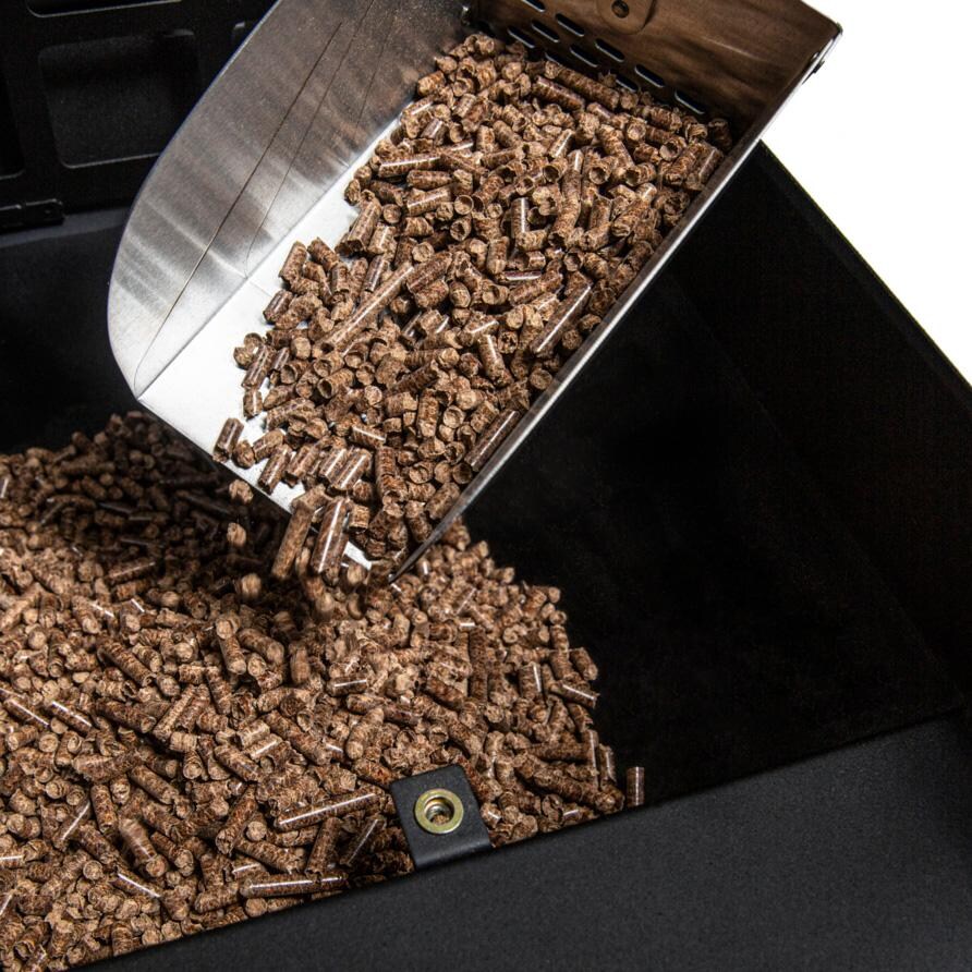 Broil King Stainless Steel Pellet/ Charcoal Scoop - 63946 - Dumping Into Hopper - White Background thumbnail