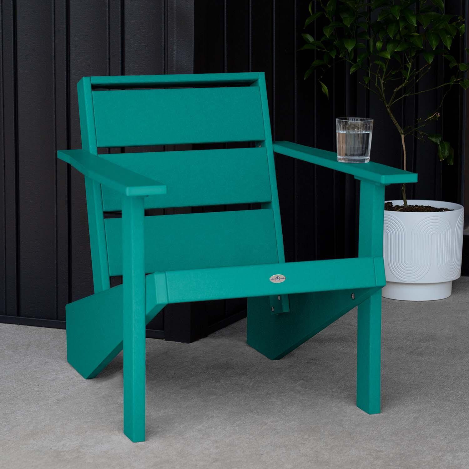 Hazel Cove Recycled Plastic Adirondack Chair in Seaglass Blue by Lakeview Outdoor Designs - Next to Flowerpot - Lifestyle thumbnail
