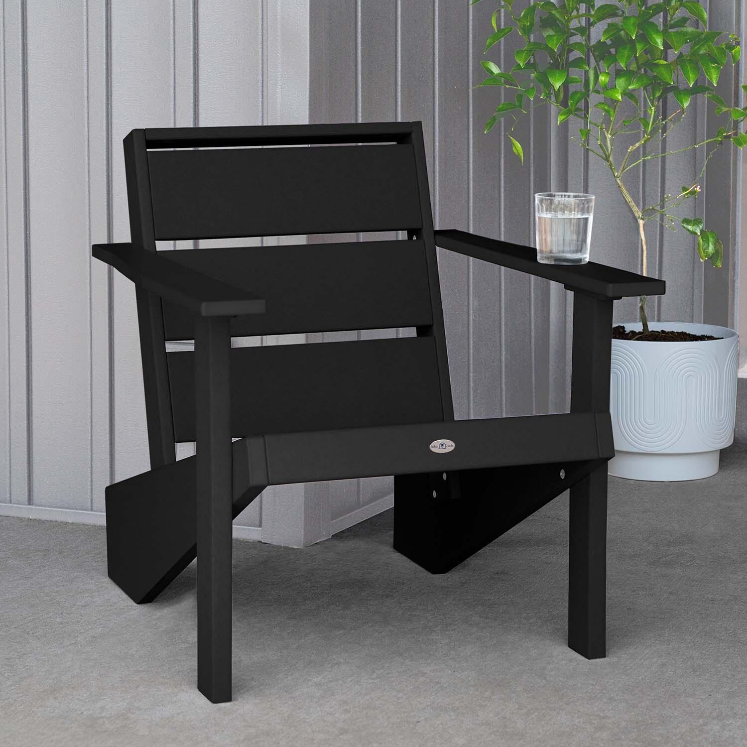 Hazel Cove Recycled Plastic Adirondack Chair in Black Sand by Lakeview Outdoor Designs - Next to Flowerpot - Lifestyle thumbnail
