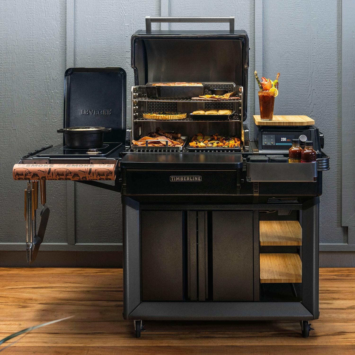 Traeger All-New Timberline Wi-Fi Controlled Wood Pellet Grill w/ WiFire 5 Pc Bundle - Cooking on Patio - Lifestyle thumbnail