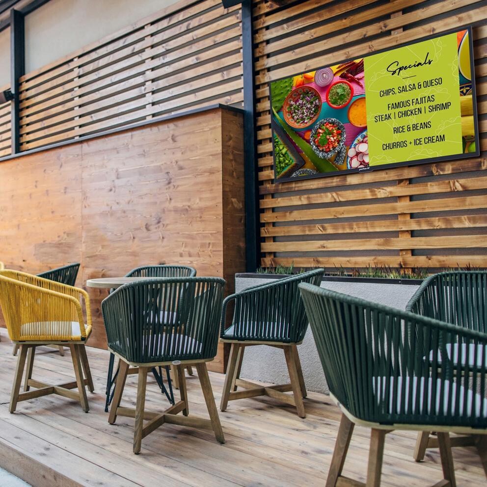 Neptune 65 Inch Full Sun 4K UHD LCD Outdoor Smart TV - WPTV654 - Restaurant Patio - Lifestyle thumbnail