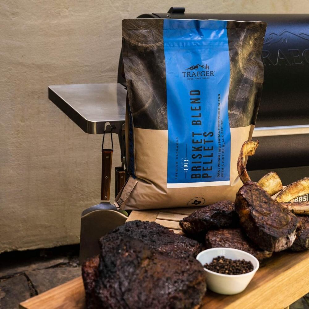 Traeger PEL348 Limited Edition Brisket Blend Pellets - 18 Lb. - Shown with Brisket and Tomahawk Steaks thumbnail