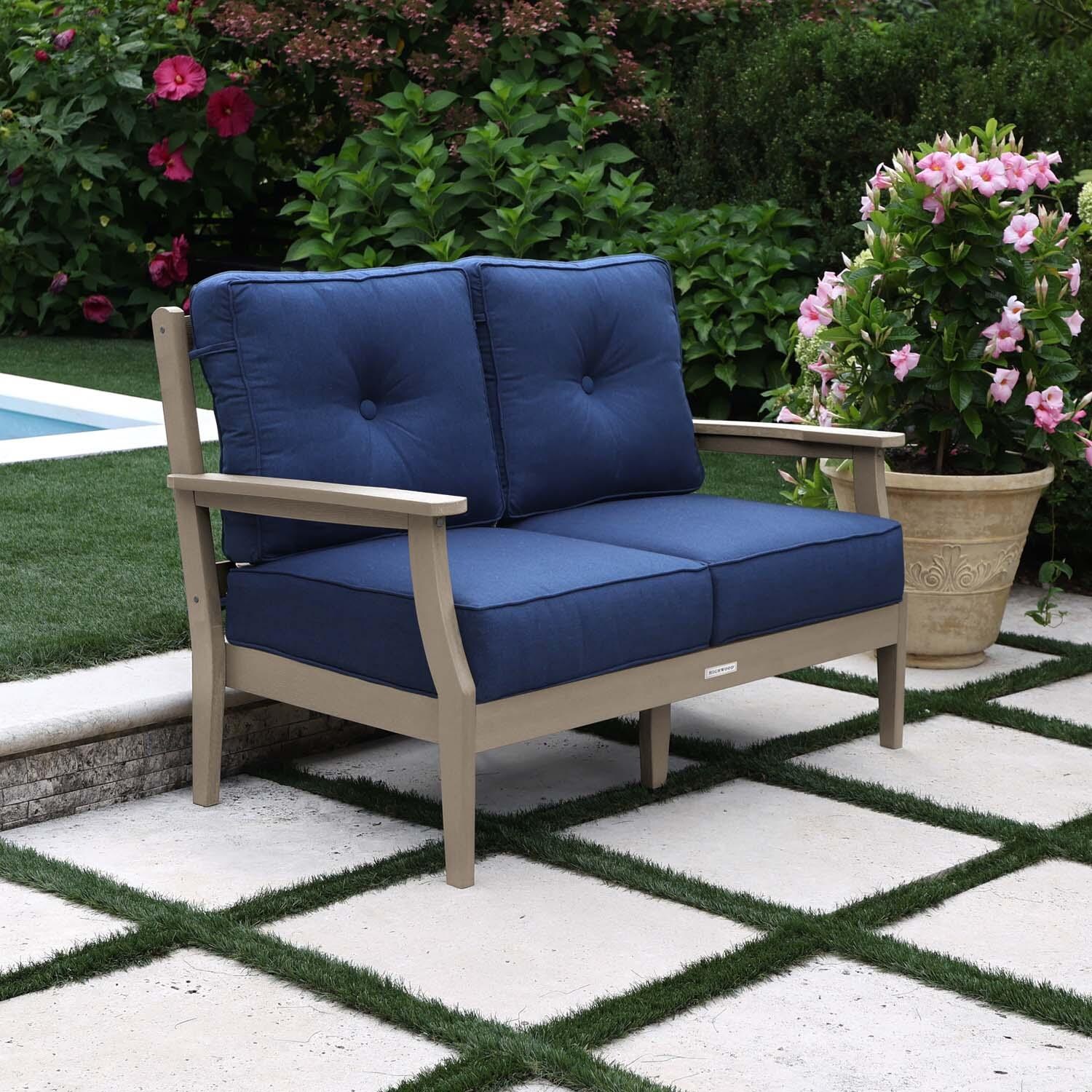 Blushing Bay 2 Person Recycled Plastic Loveseat in Spectrum Indigo/Woodland Brown by Lakeview Outdoor Designs - Left Angled - Lifestyle thumbnail