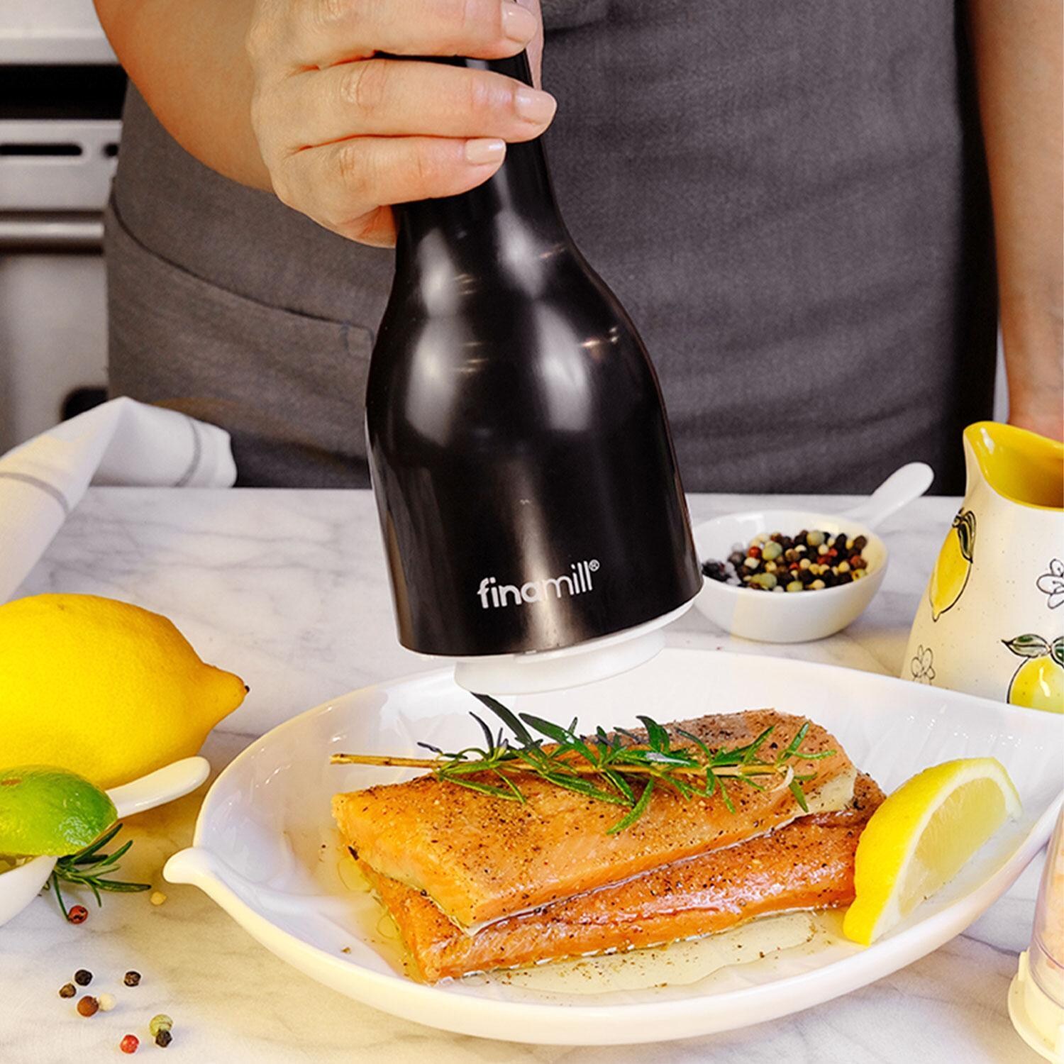 FinaMill GP803437-111MIB Classic Battery Spice Grinder in Midnight Black w/ 1 Everyday Pod & 1 Peppercorn Pod - In Use - Lifestyle thumbnail