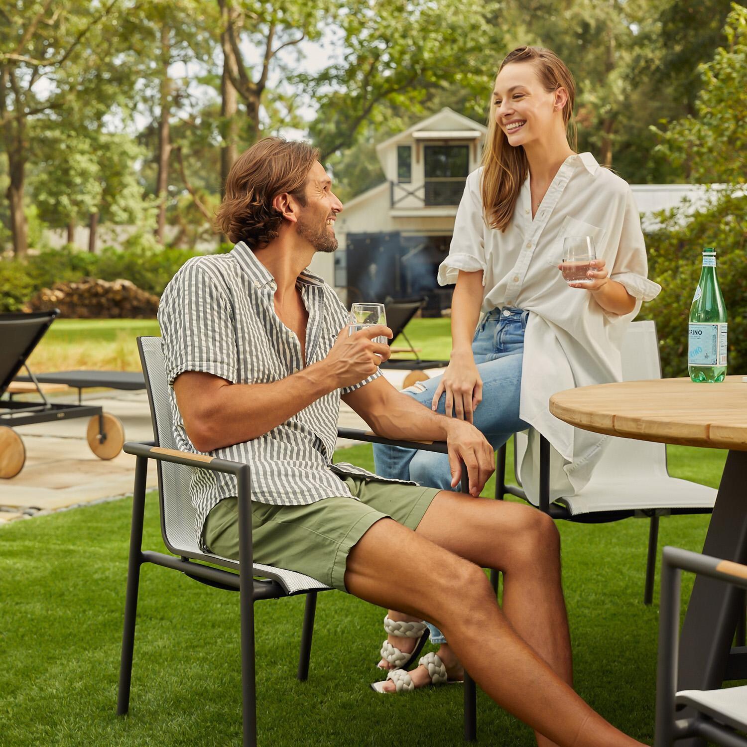 Teak + Table Paros Stacking Dining Chair in Asteroid/White - Lifestyle thumbnail