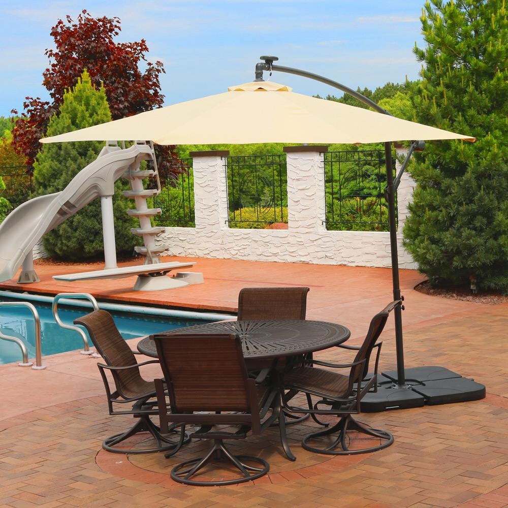 Ultimate Patio 10 Ft. Solar Lighted Octagonal Patio Cantilever Umbrella W/ Crank - Beige - Lifestyle View thumbnail