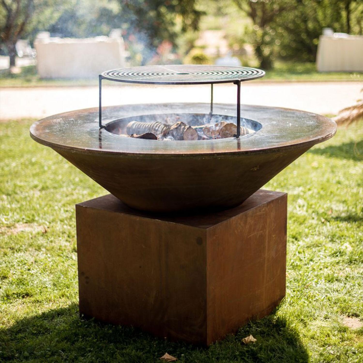 OFYR O-XL XL Corten 59 Inch Wood-Fired Flat Top Grill - Wood Burning - On Grass - Lifestyle thumbnail