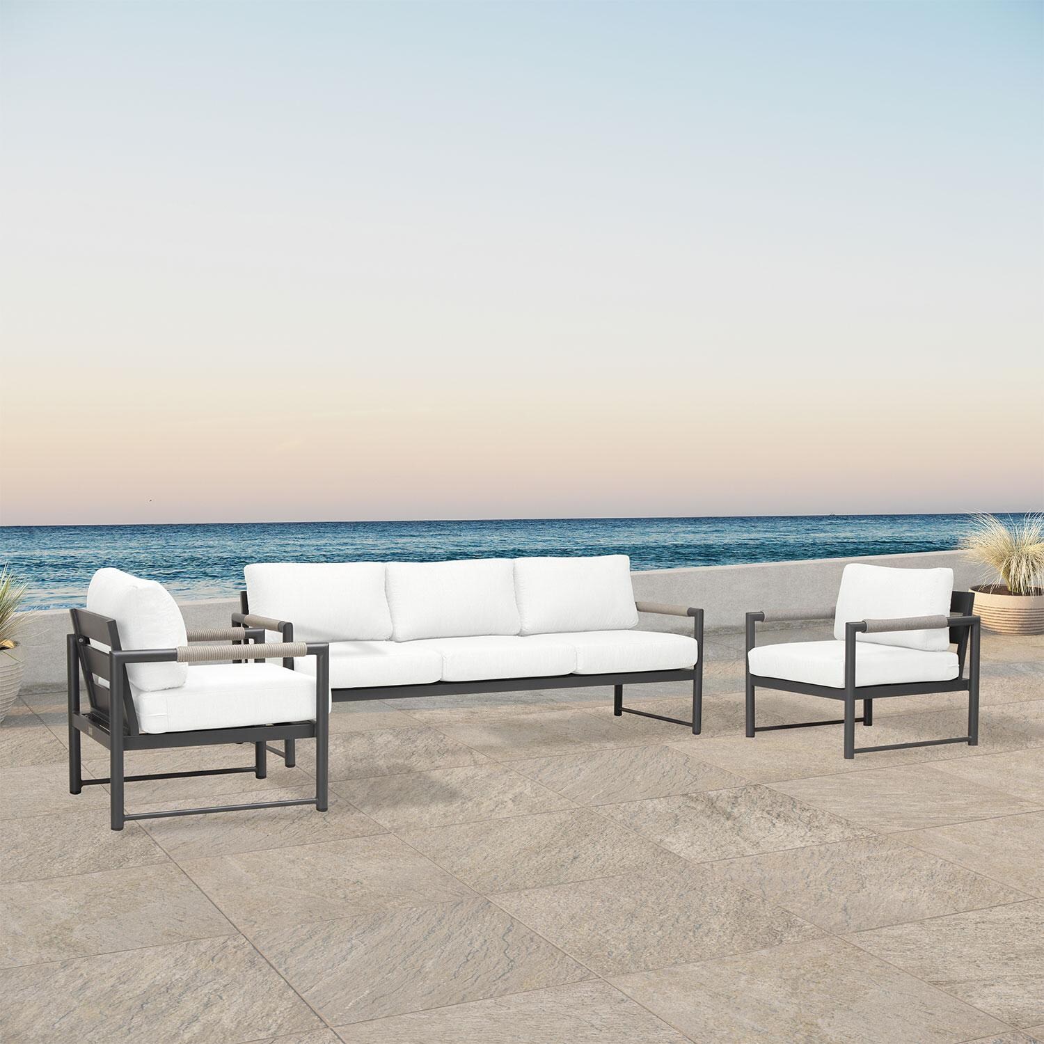 Lakeview AVEBAY-SL-PG-SET141-CN Avenue Bay Slate/Pebble Gray 3 Pc Sofa Club Chair Set - Canvas Natural - Angled On Patio - Lifestyle thumbnail