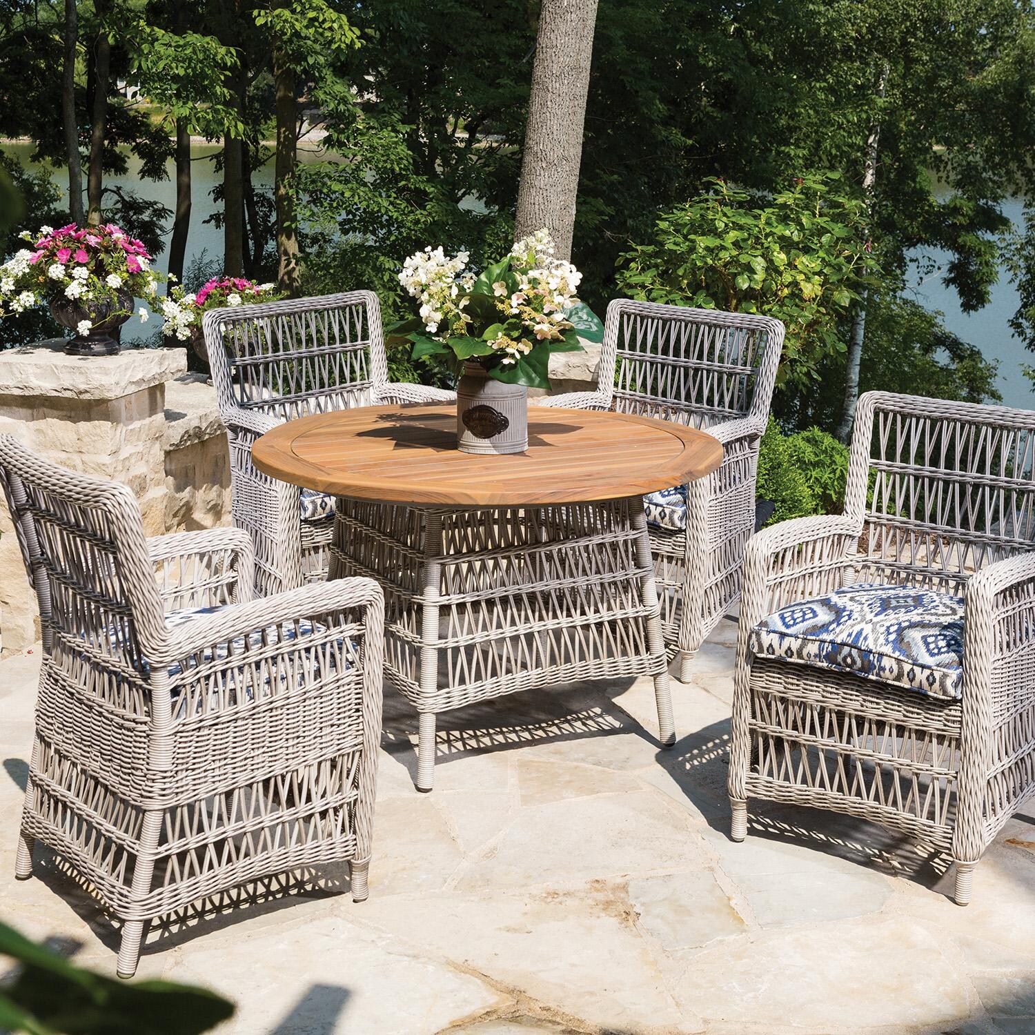 Lloyd Flanders Mackinac Dining Armchair - 4 Shown with Round Dining Table thumbnail