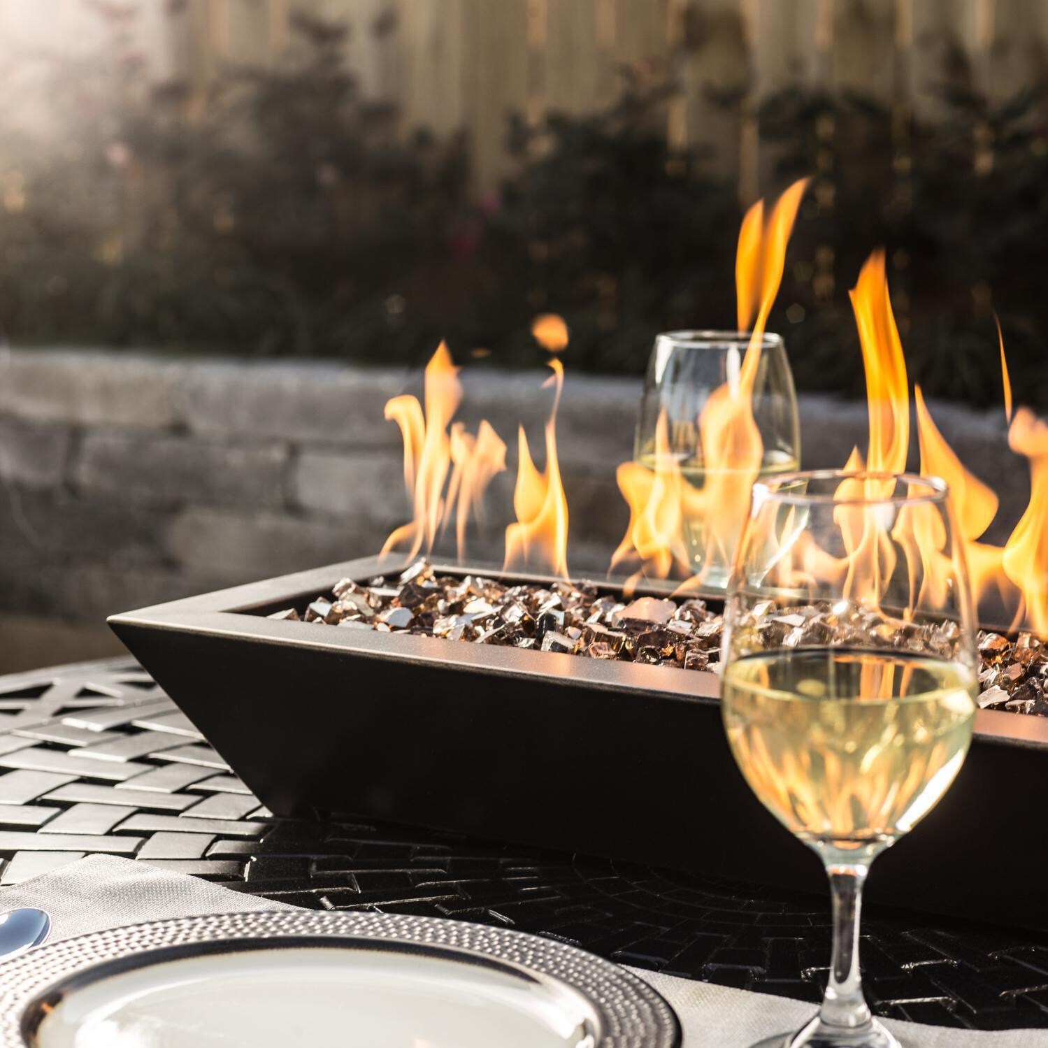 BBQGuys Signature Series Westfalen 18-Inch Table-Top Propane Fire Pit - Oil Rubbed Bronze - In Use - Shown with 1/2 inch Roman Bronze Reflective Fire Glass (Sold Separately) thumbnail