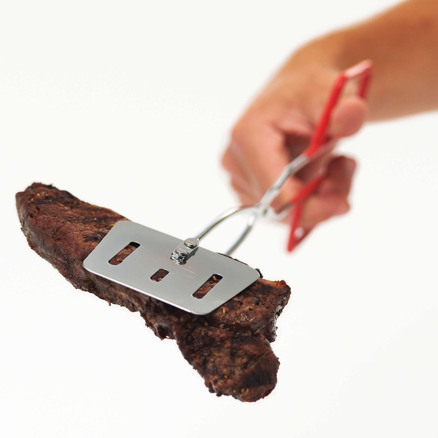 GrillPro Chrome Plated 2-in-1 Turner/ Tongs - 40730 - Holding Meat 1 - White Background thumbnail