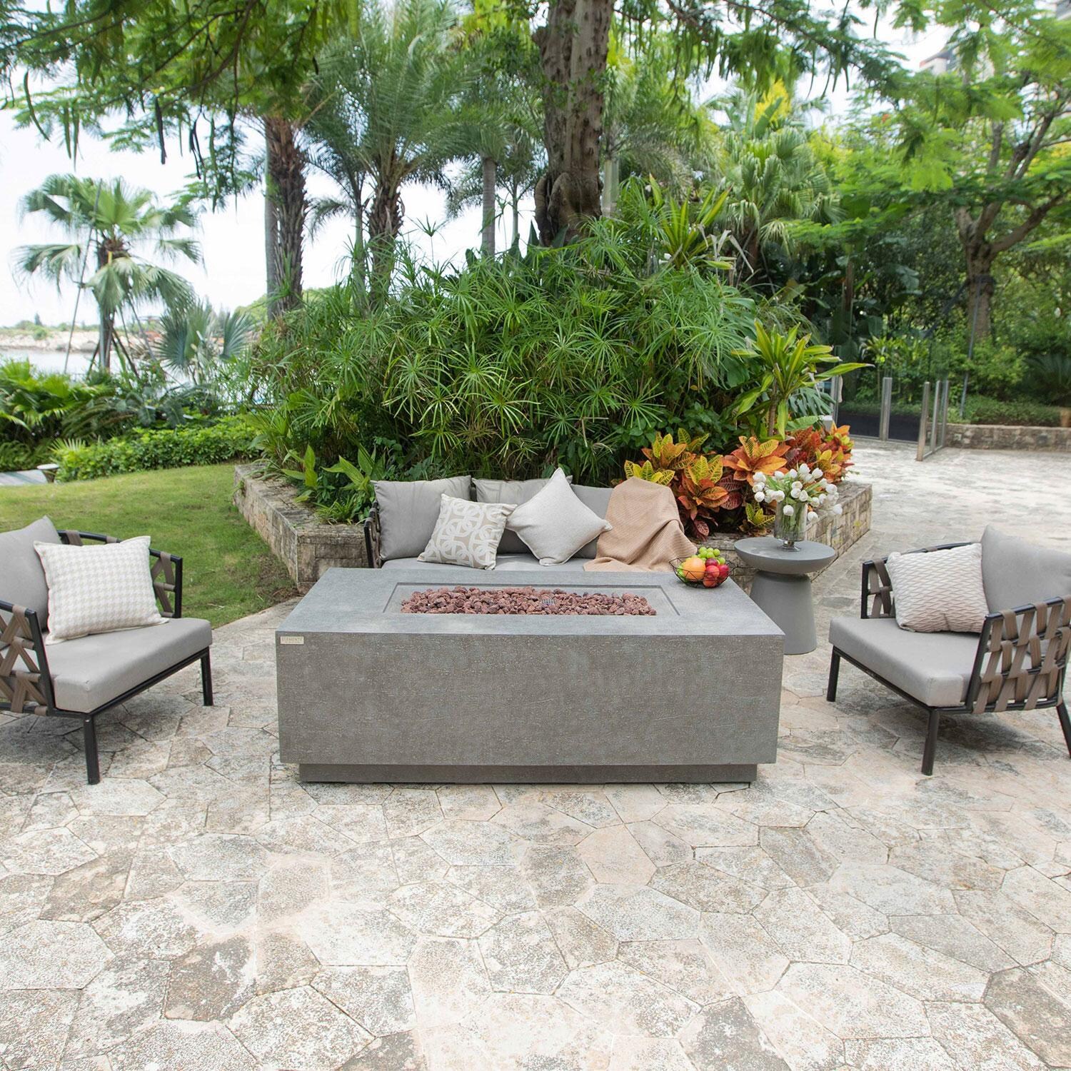 Andes 66 Inch Hidden Tank Rectangle GFRC Concrete Propane Fire Table in Light Gray By Elementi - On Patio - Lifestyle thumbnail