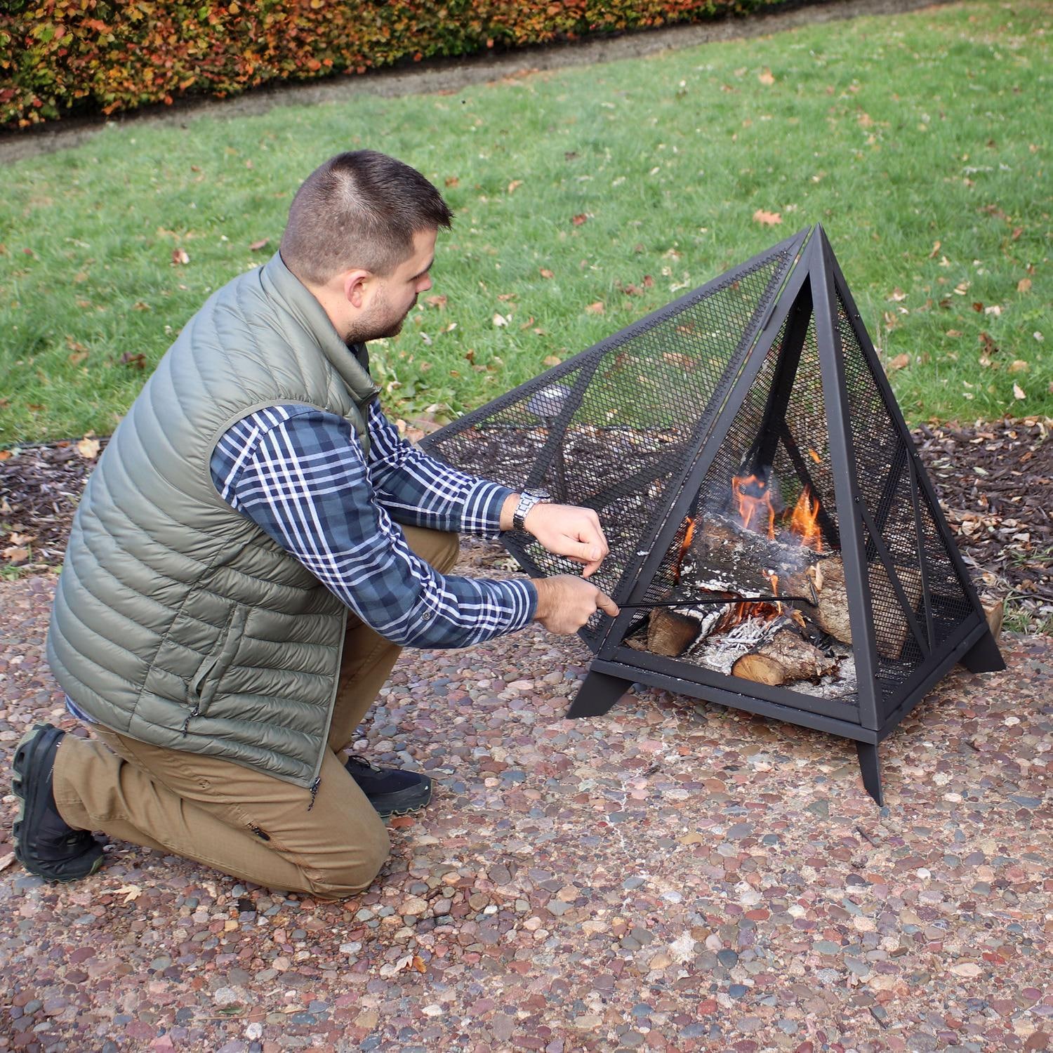 Ultimate Patio NB-048 25 Inch Pyramid Steel Wood Burning Fire Pit in Black - Tending the Flame - Lifestyle thumbnail