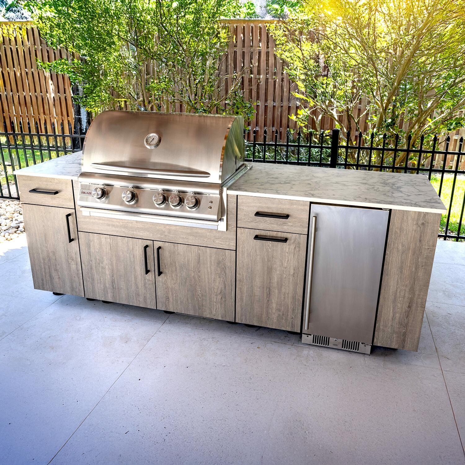 BBQGuys Signature Oasis 8 Ft Outdoor Kitchen Island w/ Blaze Natural Gas Grill & Refrigerator in Riverside Oak/Icecap White - Island - Lifestyle thumbnail