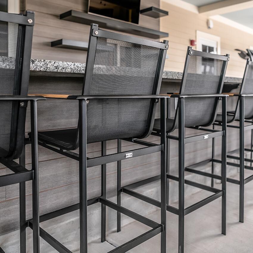 Teak + Table St Barts Aluminum Bar Chair in White - Back Detail - Lifestyle thumbnail