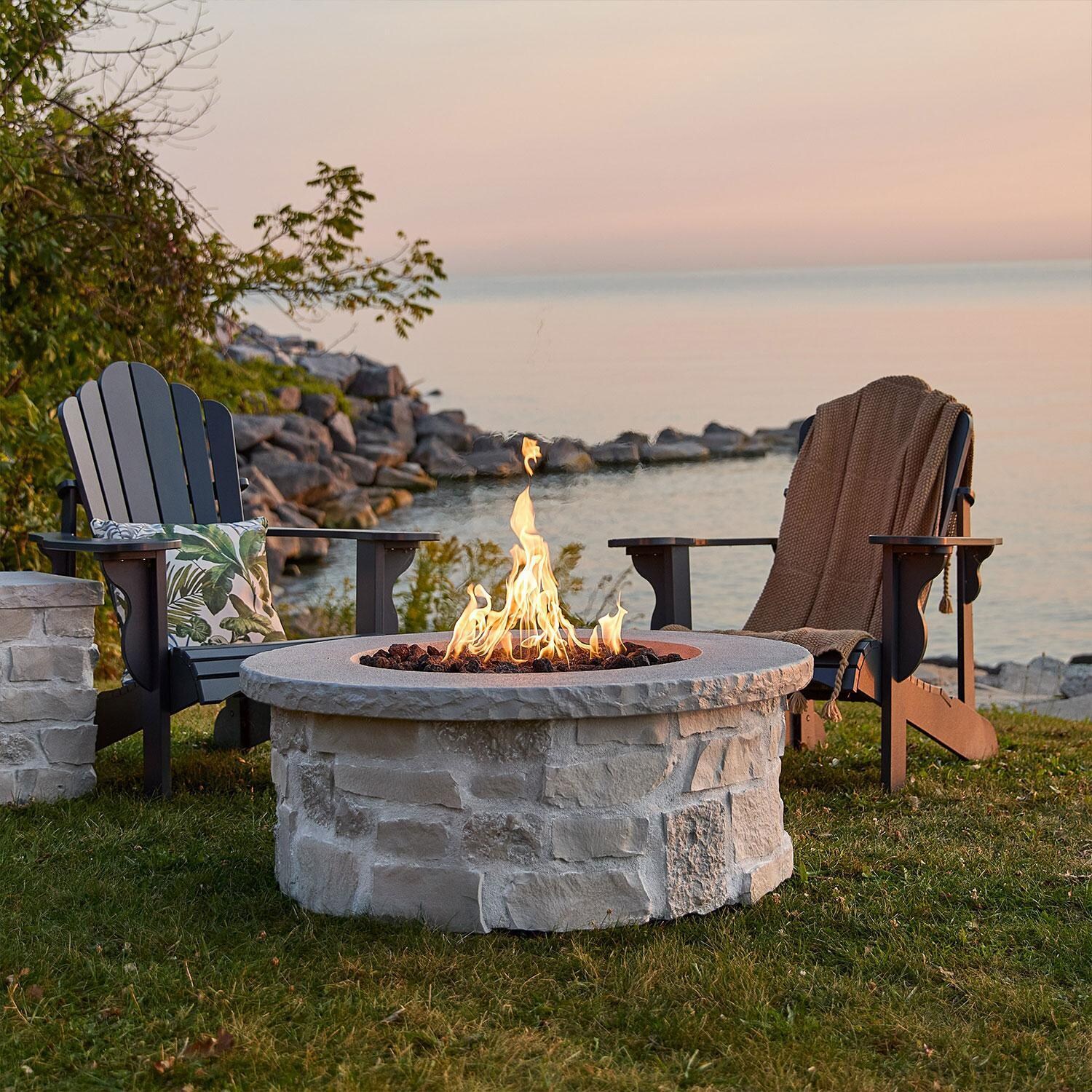 Heritage 40 Inch Round Stone Natural Gas Fire Pit Table in Beige by Lakeview (Ships Propane w/ Conversion Kit) - Lakeside View - Lifestyle thumbnail