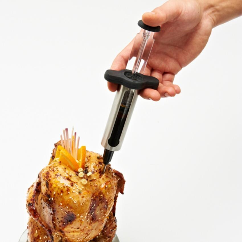 Broil King Stainless Steel Marinade Injector - 61495 - Injecting Chicken - White Background thumbnail