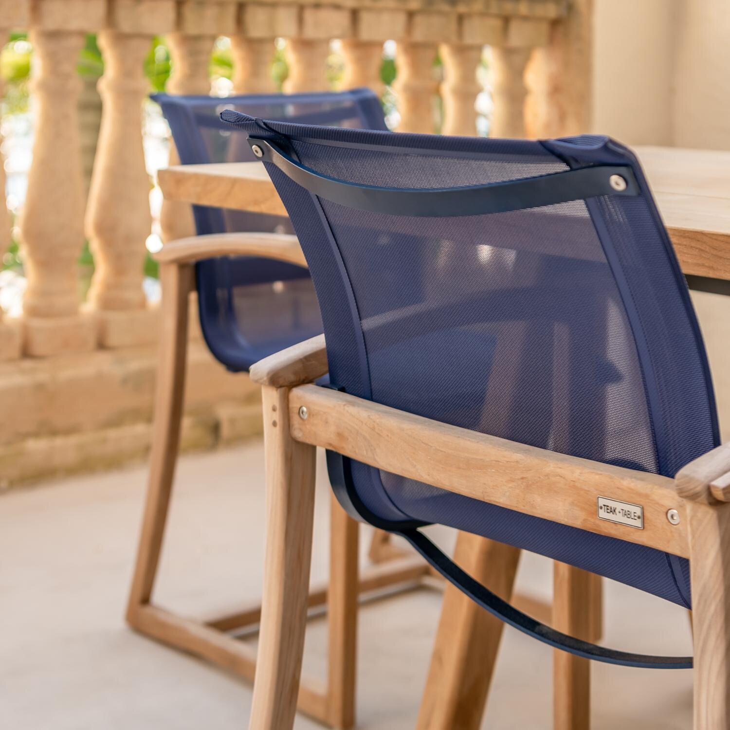 Teak + Table Capri Sling Dining Chair in Navy - Back Detail - Lifestyle thumbnail