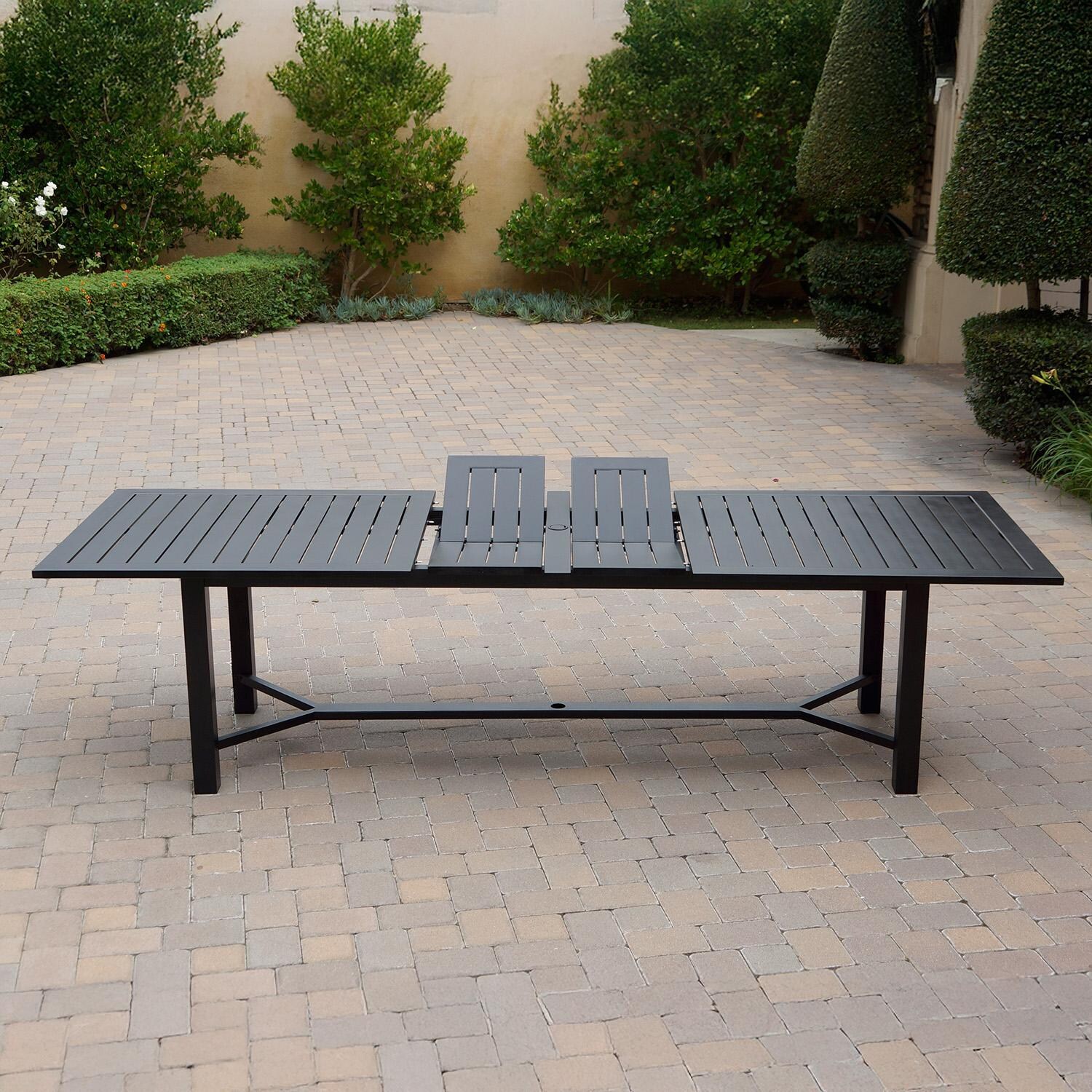 Darlee B/DL13-11PCDR-2350LE-N Nassau 11 Pc Cast Aluminum Dining Set w/ Rocker in Antique Bronze w/ Navy Cushions - Table Side View w/ Extension - Lifestyle thumbnail