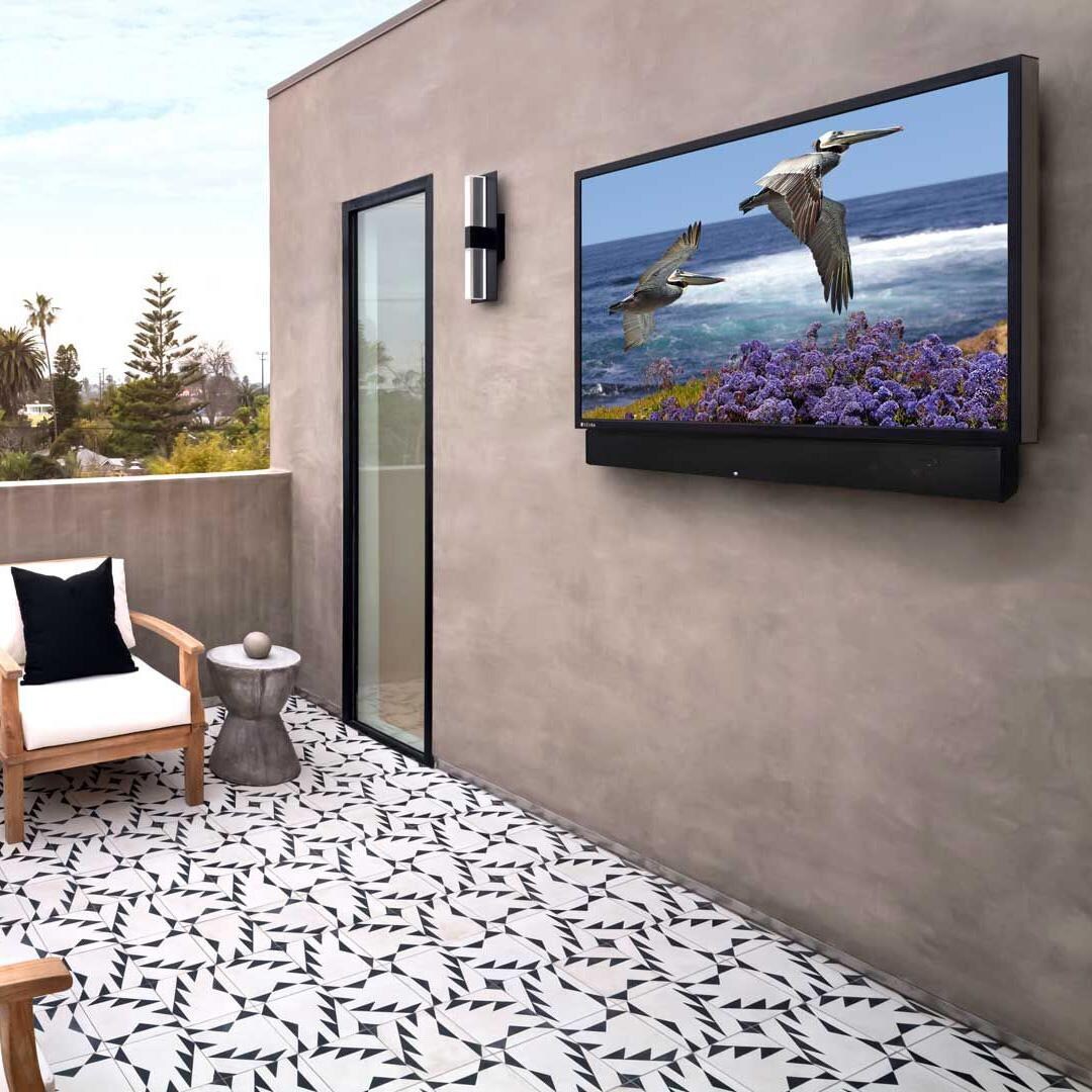 Seura UB4-85-SSB-2 85-Inch TV with soundbar - TV with Soundbar mounted on wall outside thumbnail