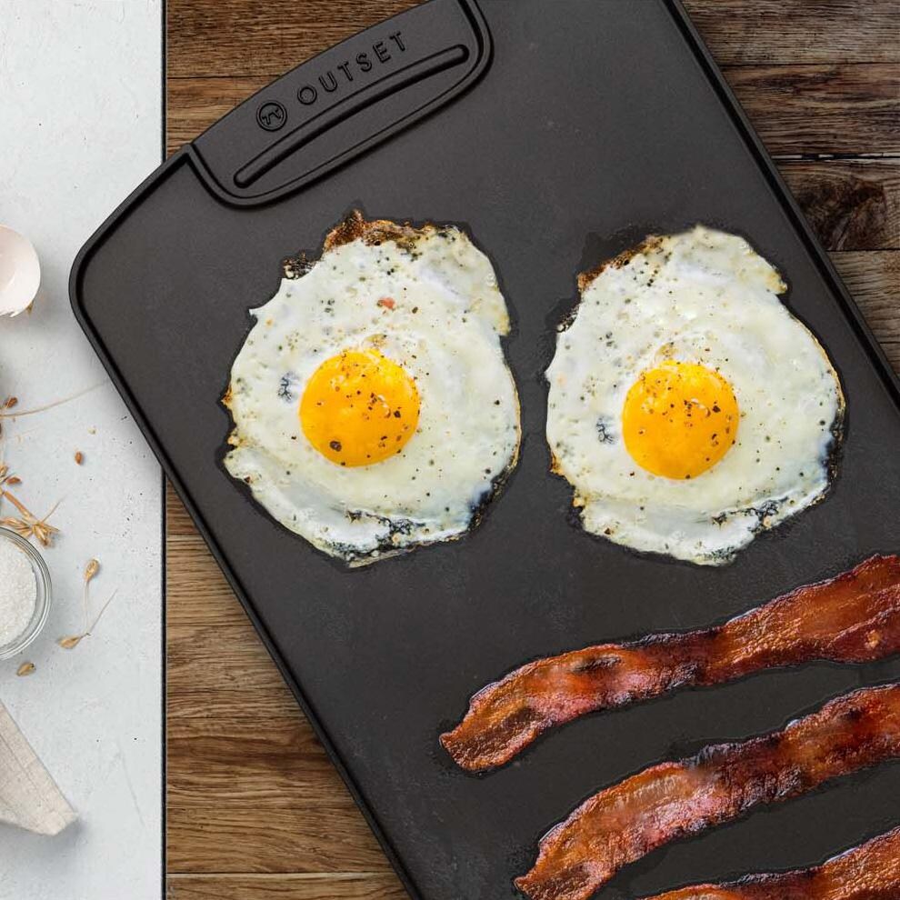 Outset  76648 Reversible Cast Iron Griddle - Eggs & Bacon - White Background thumbnail