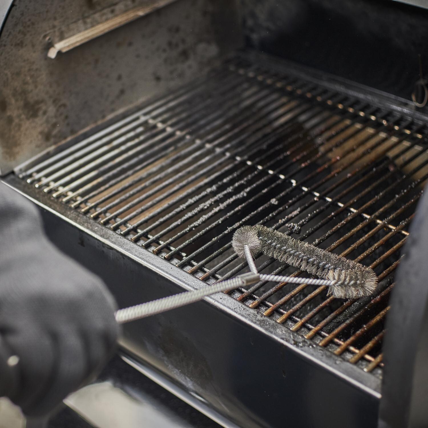 Weber 22510201 SmokeFire EX4 Gen 2 24-Inch Wi-Fi Enabled Wood Fired Pellet Grill - Cleaning Grates - Lifestyle thumbnail