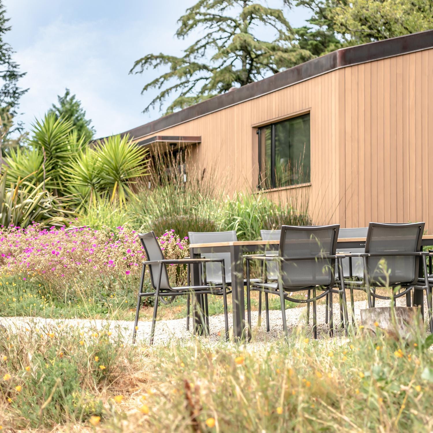 Teak + Table Paros Stacking Dining Chair in White - Lifestyle thumbnail