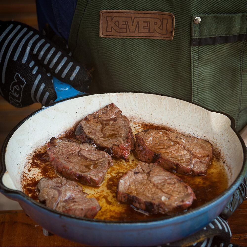 Keveri AGLO Extreme Heat Gloves - Gloves holding skillet - Lifestyle thumbnail