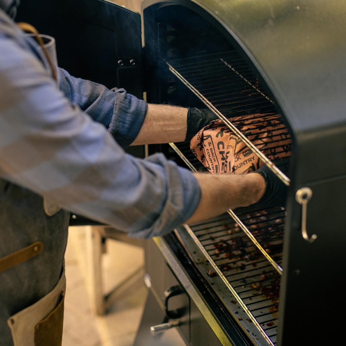 Camp Chef PGSBXXL XXL Pro WIFI Vertical Smoker - Loading the Smoker - Lifestyle thumbnail