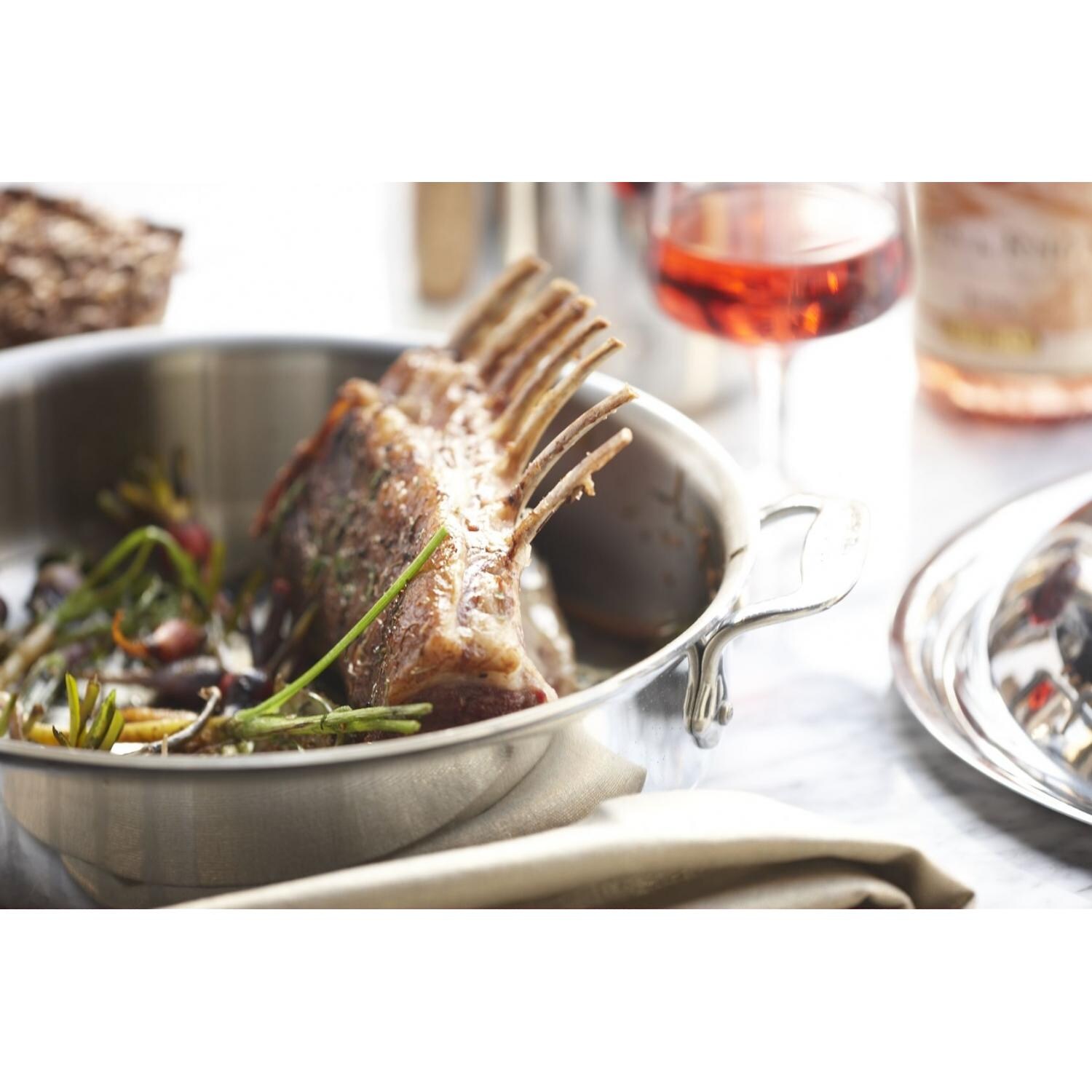 All-Clad Stainless 6-Quart Stock Pot With Lid In Use thumbnail