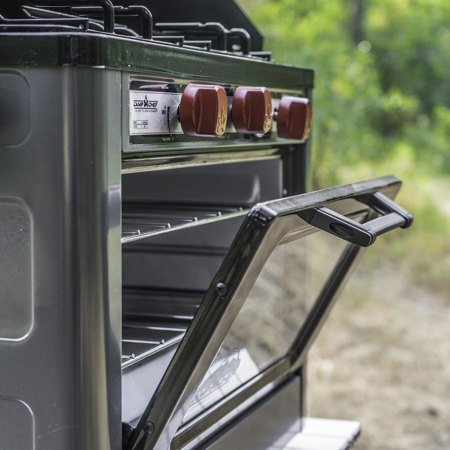 Camp Chef COVEND Deluxe Outdoor Camp Oven - Oven Door Partially Open thumbnail