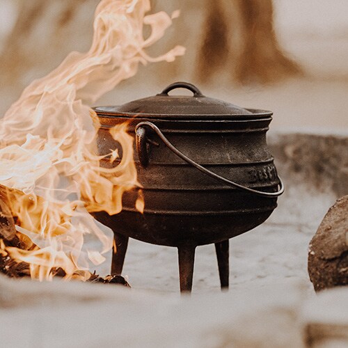 Cast Iron Camp Pot next to an open flame