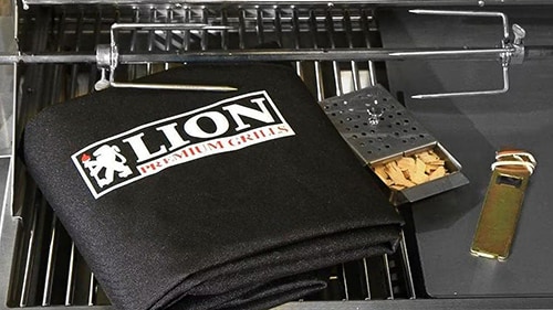 Cover, rotisserie, smoker box, and grate lifting tool shown