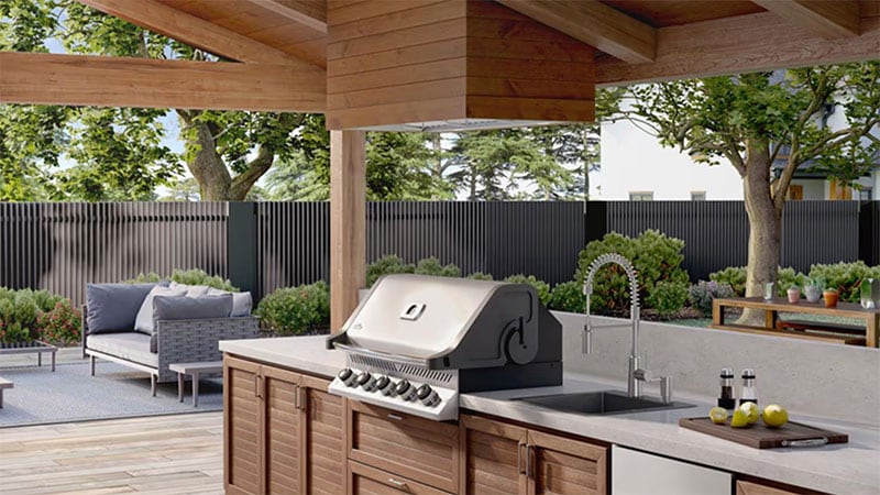 Outdoor kitchen with spruce-wrapped vent hood