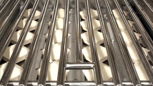 ceramic briquettes below the grill grate