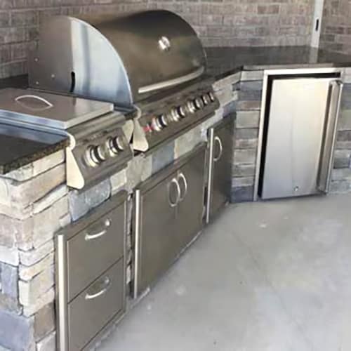 Side view of the grill, side burner, storage and refrigerator