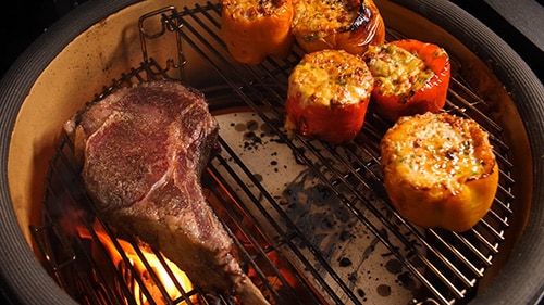Steak and Stuffed Peppers cooking on different levels of the Divide and Conquer System