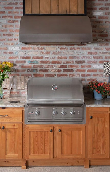 Wooden cabinets with a stainless steel grill built in to it