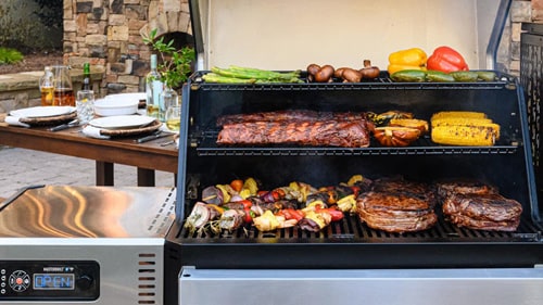 All 3 levels of the Masterbuilt grill loaded with bbq