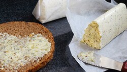 Compound butter in a log being spread