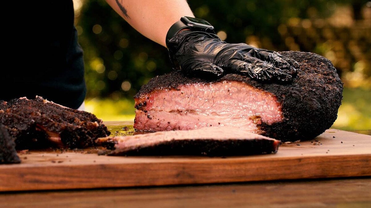 Kelsey Heidkamp slicing through a brisket