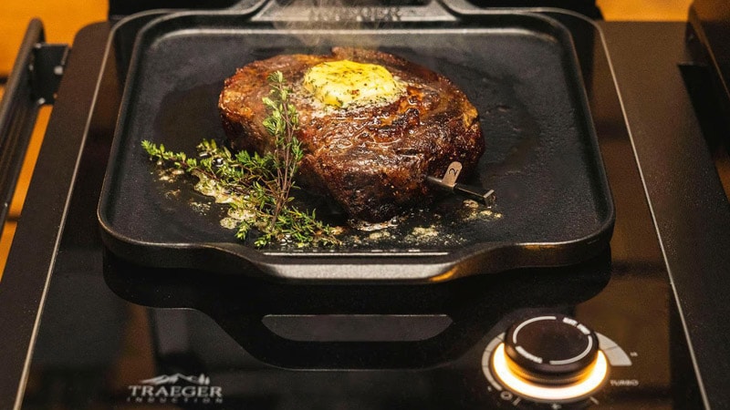 Steak searing on the cast iron skillet induction cooktop
