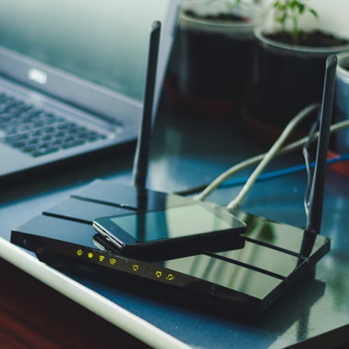 Internet Modem with smart phone sitting on top