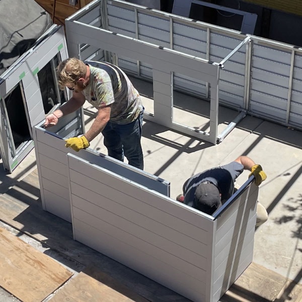 Man assembling an outdoor kitchen
