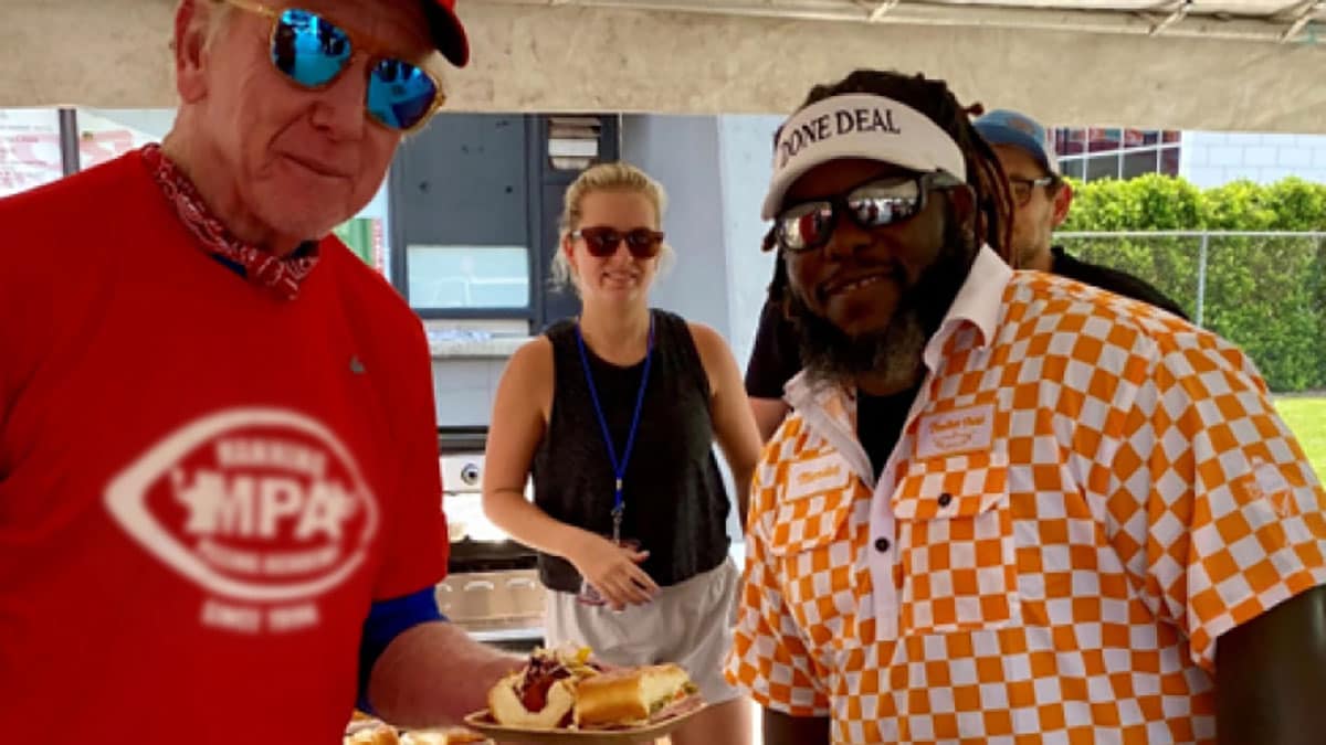 Chris Hurt hosting a cookout with hot dogs